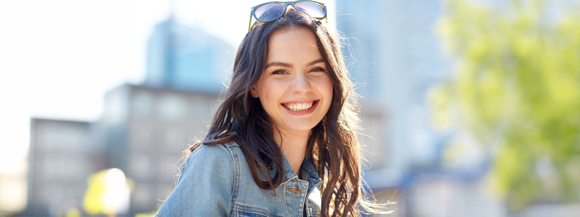 Sandy patient smiling after veneers.