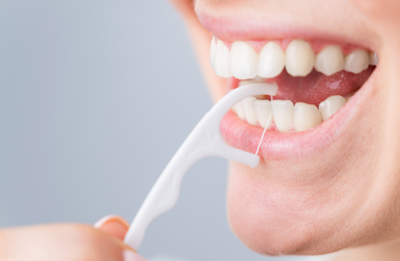 Close-up of woman flossing